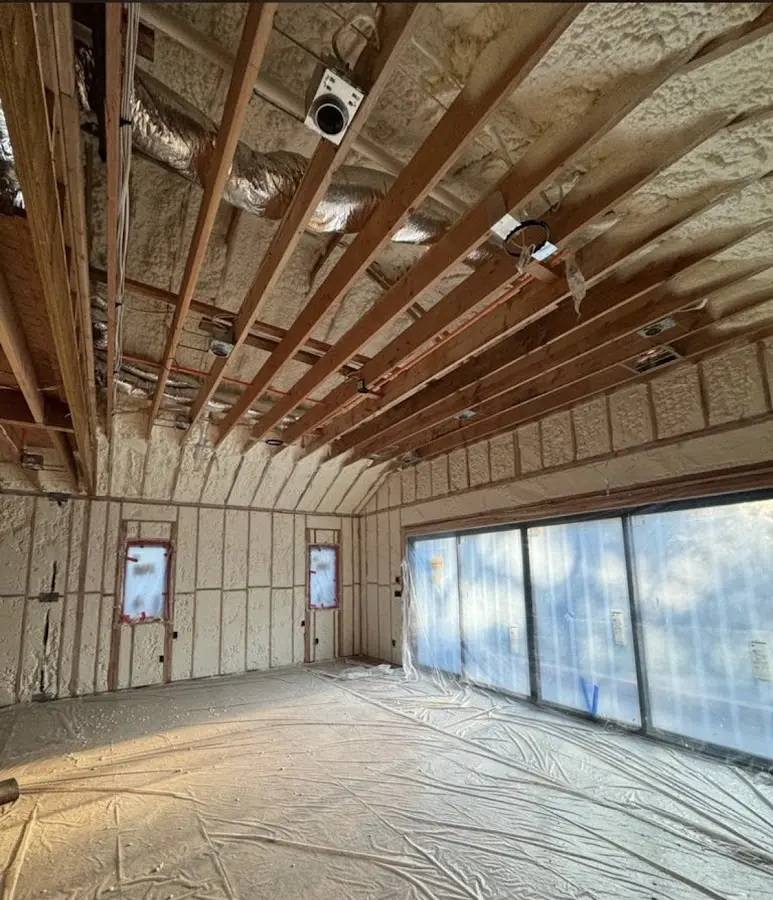 Interior walls and ceiling insulated with spray foam during new construction in Collier